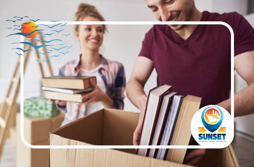 A couple packing books into boxes together Sunset International Shipping Logo