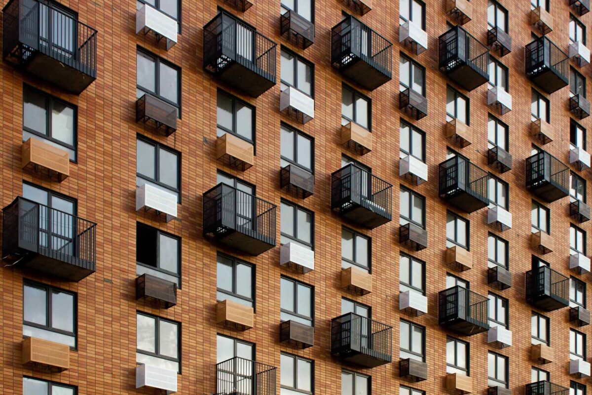 A brown and black apartment building