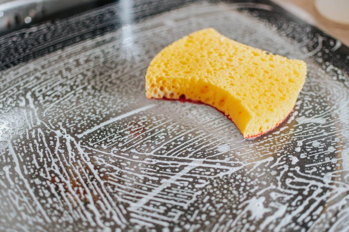A sponge on a soapy surface