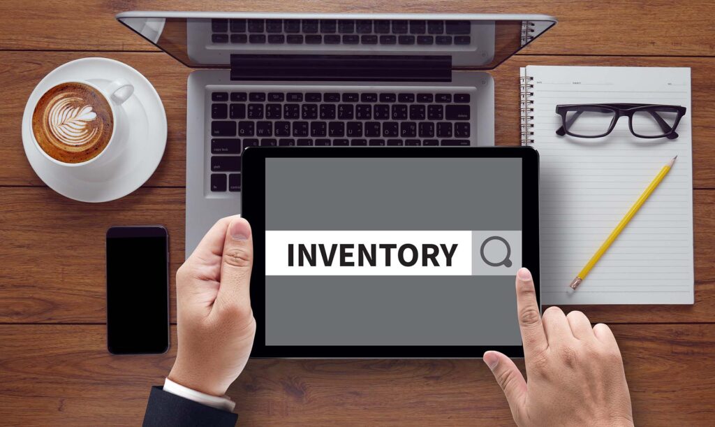 INVENTORY CONCEPT, on the tablet pc screen held by businessman hands - online, top view