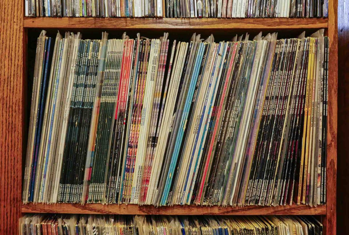 Records vertically stacked on the shelf