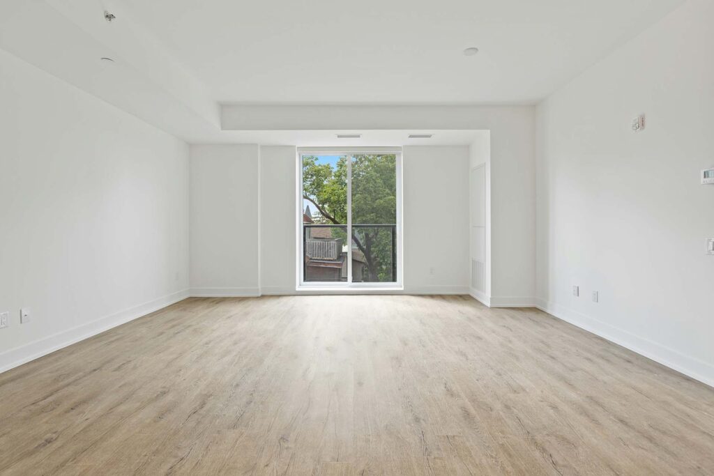 An empty room with wooden floors