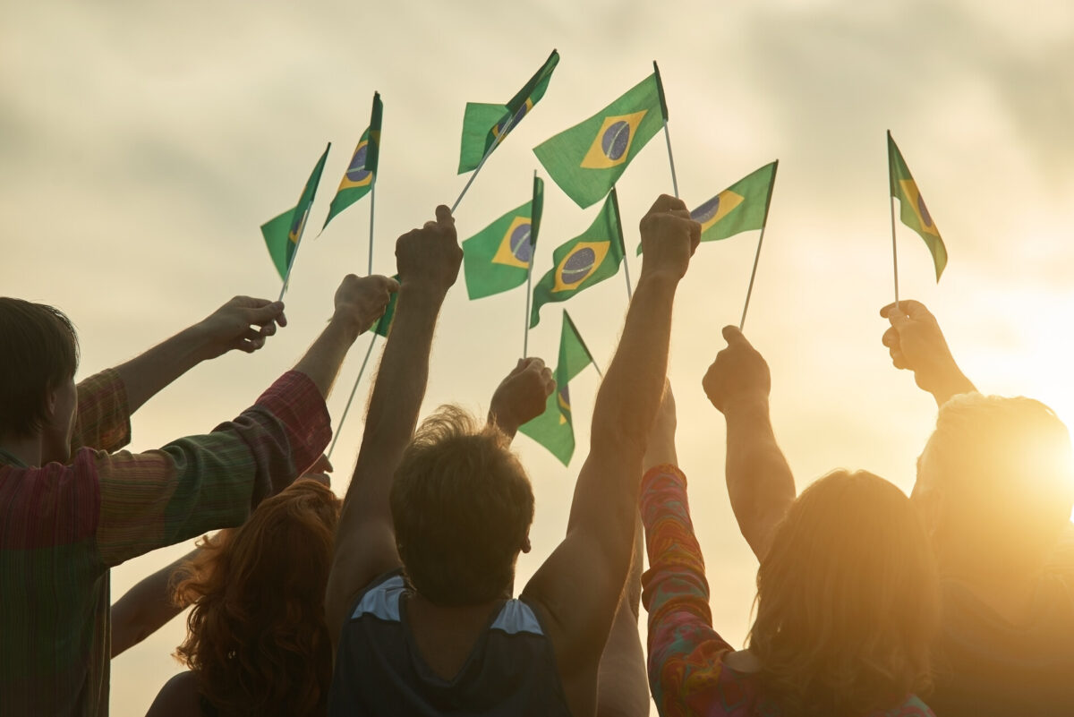 People raising Brazilian flags