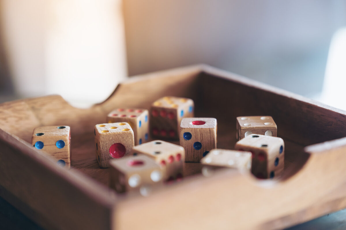 Wooden dice in a tray