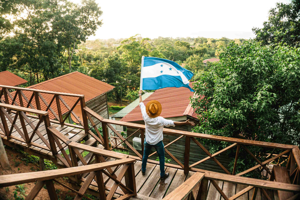 A man waving the flag of Honduras