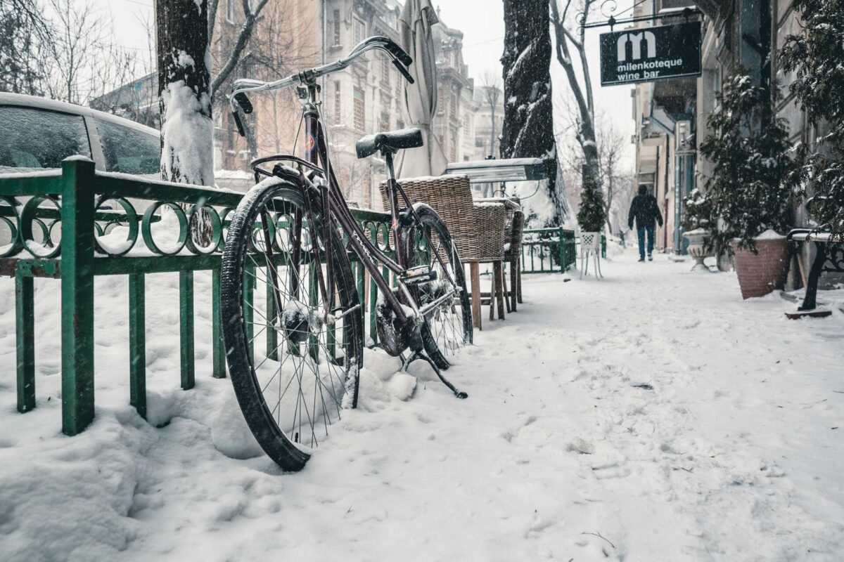 Bike on the street covers in snow