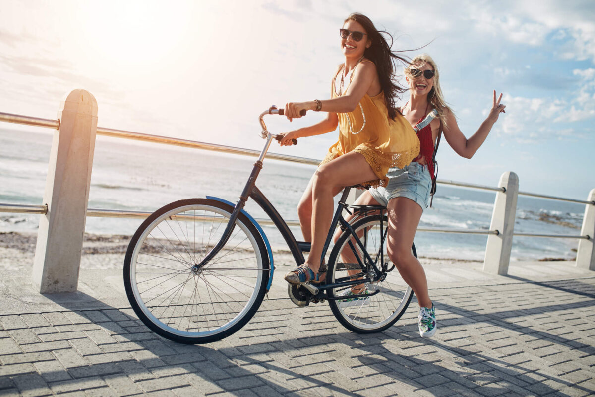 Two girls riding a bike