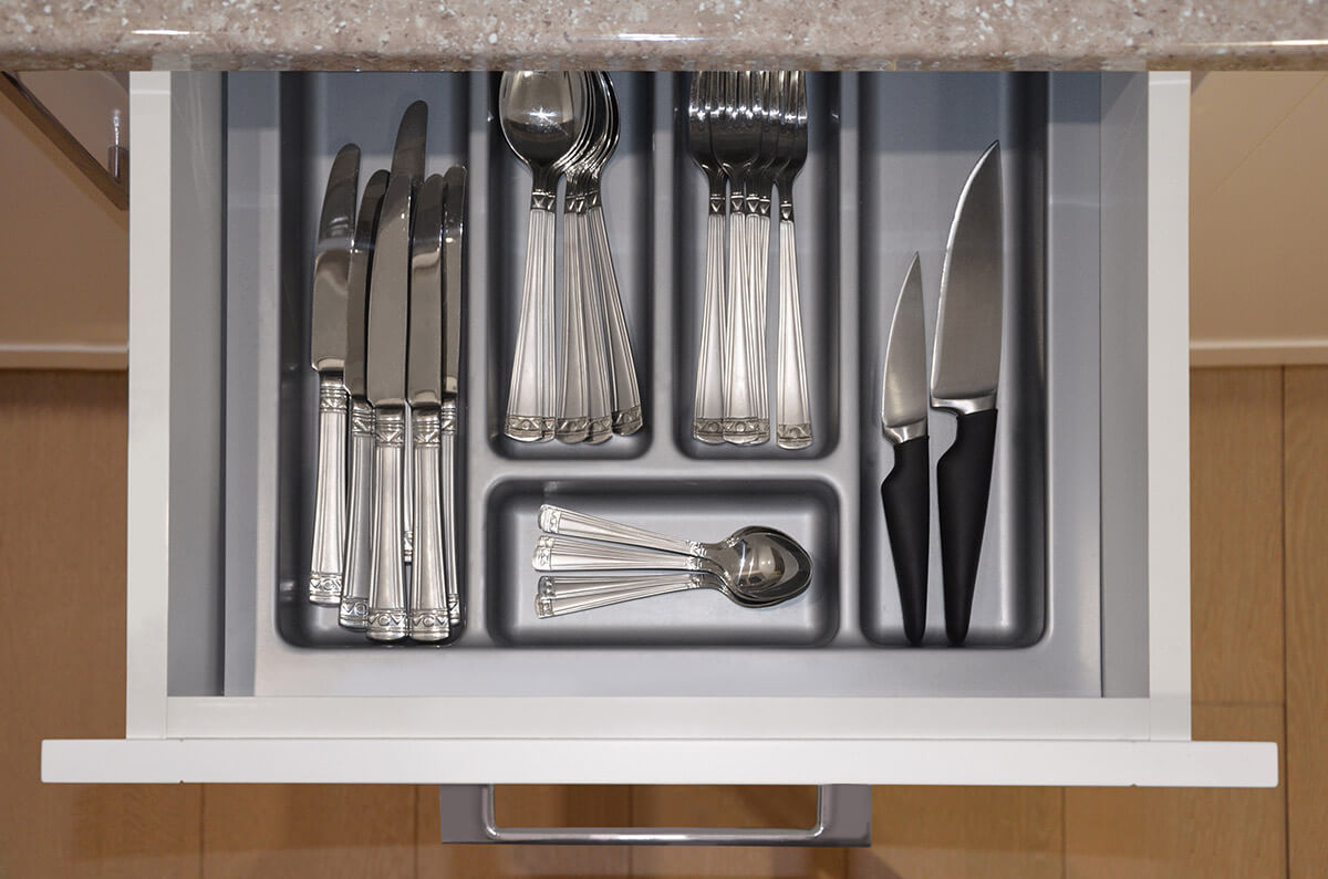 Cutlery stacked after moving overseas