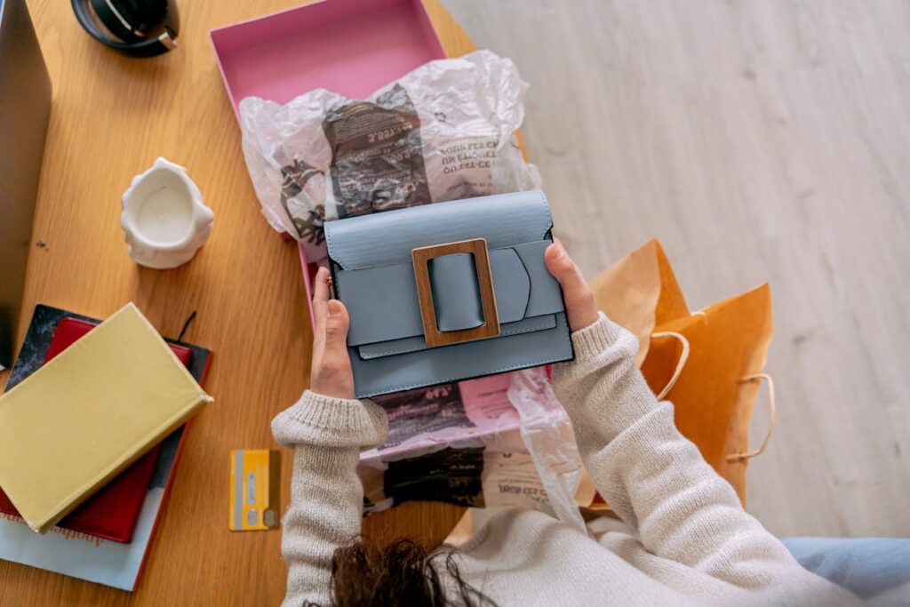Woman holding a blue purse